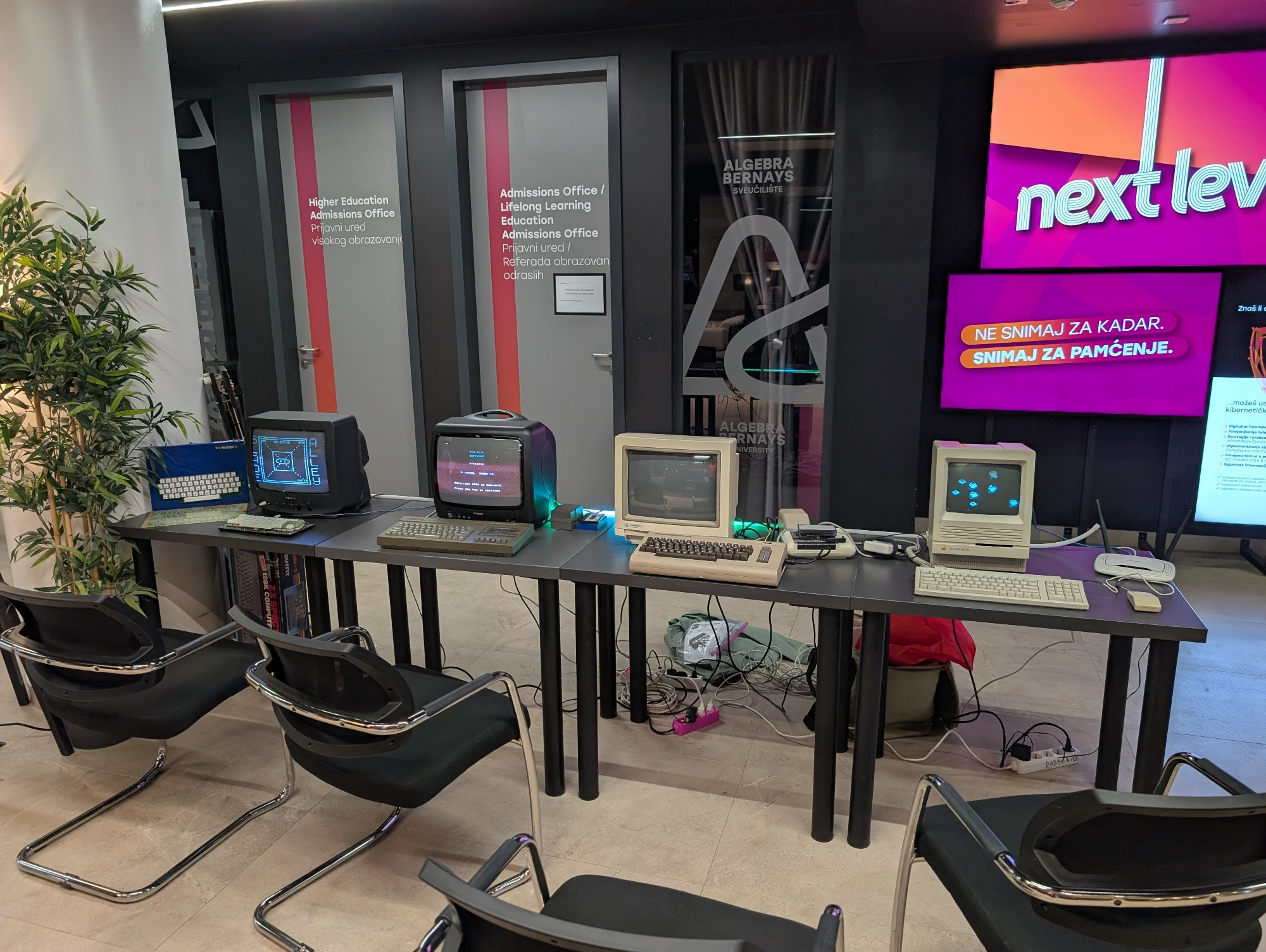 A bunch of vintage computers on display
