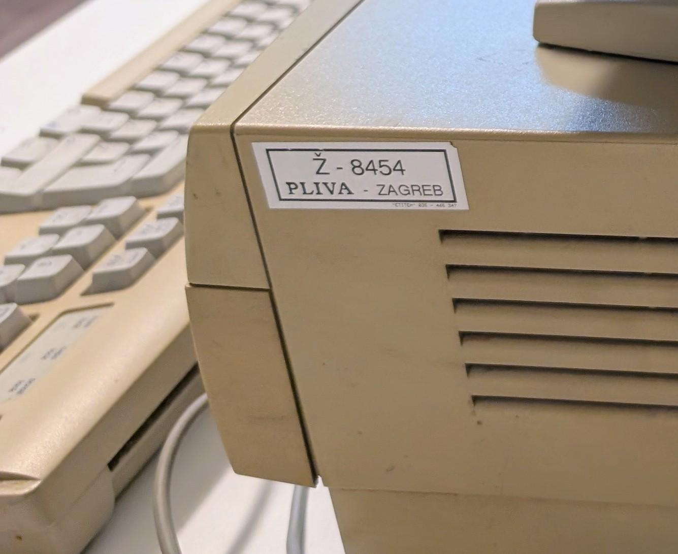 Asset tag on a beige computer
