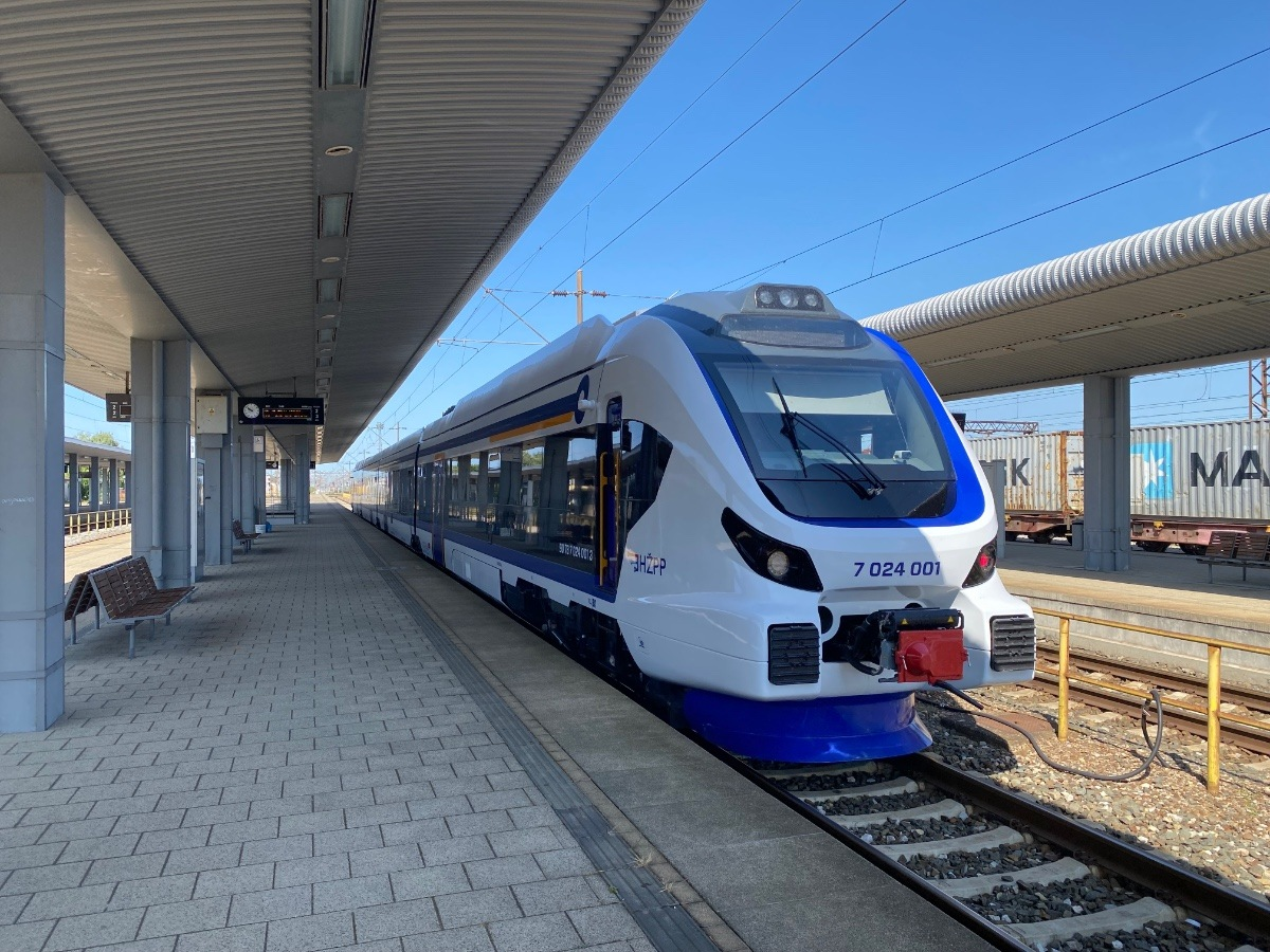 White and blue train at platform